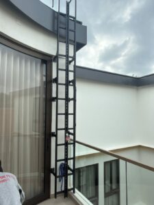 SS304 vertical access ladder with fall arrest rail for rooftop access Singapore
