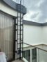 SS304 vertical access ladder with fall arrest rail for rooftop access Singapore