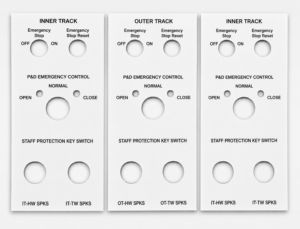 Custom traffolyte nameplate with engraved text and precision cut-outs for industrial control panel applications.